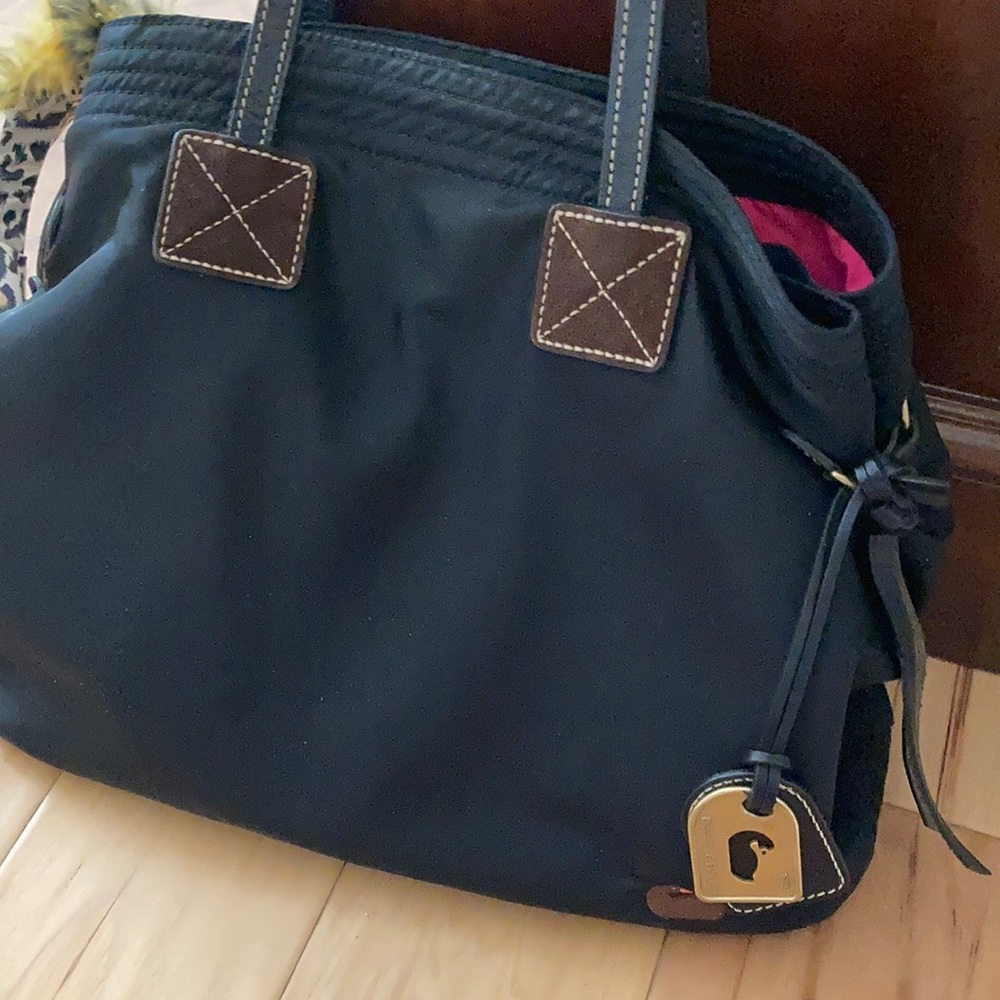 Large bag by Dooney and Bourke.